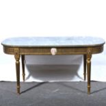 A brass magazine rack, and a marble effect coffee table.