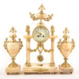 A large 19th Century French gilt bronze and onyx clock garniture, Comptoir General Schnerb, Paris.