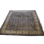 A large Persian pattern carpet