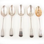 Four silver table spoons and a berry spoon.