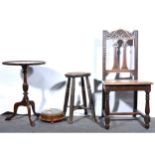 A carved oak side chair, elm stool, small walnut needlework footstool, and reproduction sidetable.