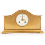 An Edwardian brass mantel clock