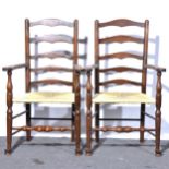 A pair of oak and elm ladder-back elbow chairs,