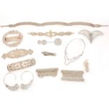 A collection of twelve Art Deco paste set accessories, buckles, hat decorations, decolletage clip.