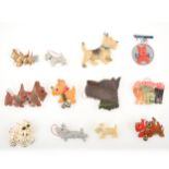 Twelve novelty vintage Scottie dog brooches, celluloid, paste, wood, enamel.