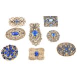 Eight 1930s Czechoslovakian white metal blue paste set brooches and clip.