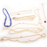 A box of simulated pearl necklaces, costume jewellery earrings, chains, brooches, paste necklace.