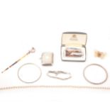 A collection of vintage costume jewellery, lighter and converted vesta case.