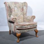 A Georgian style wing-back chair.