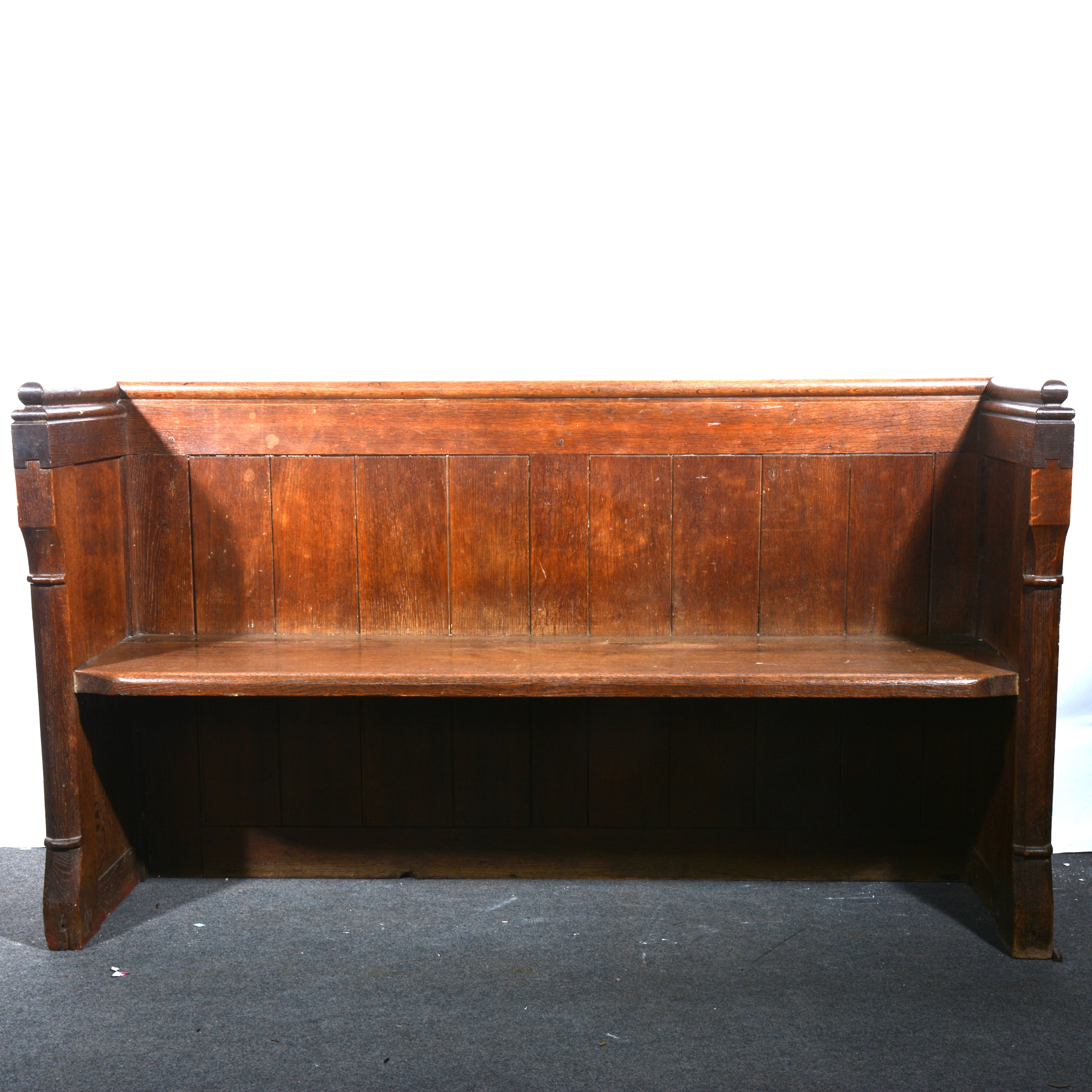 A Victorian oak pew.