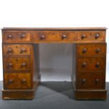 A Victorian burr walnut twin pedestal desk.