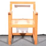 A contemporary hardwood elbow chair, by Margaret Muir.