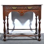 A 19th century carved oak side table.