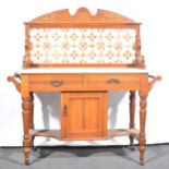 A Victorian walnut tile-backed washstand.