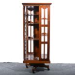 An Edwardian walnut revolving bookcase.