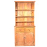 A pine pantry cupboard with dresser top.