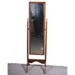 A stained walnut cheval mirror.