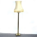 A modern brass standard lamp.