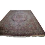 A large Persian pattern carpet.