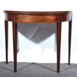 A George III mahogany demi lune tea table.