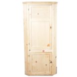 A pine freestanding corner cupboard.