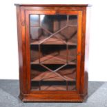 A Victorian mahogany glazed corner cabinet.