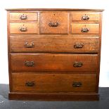 An Edwardian oak chest of drawers.