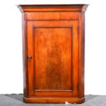 A Victorian mahogany hanging corner cupboard.