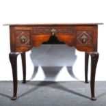 A carved oak lowboy, 19th century.