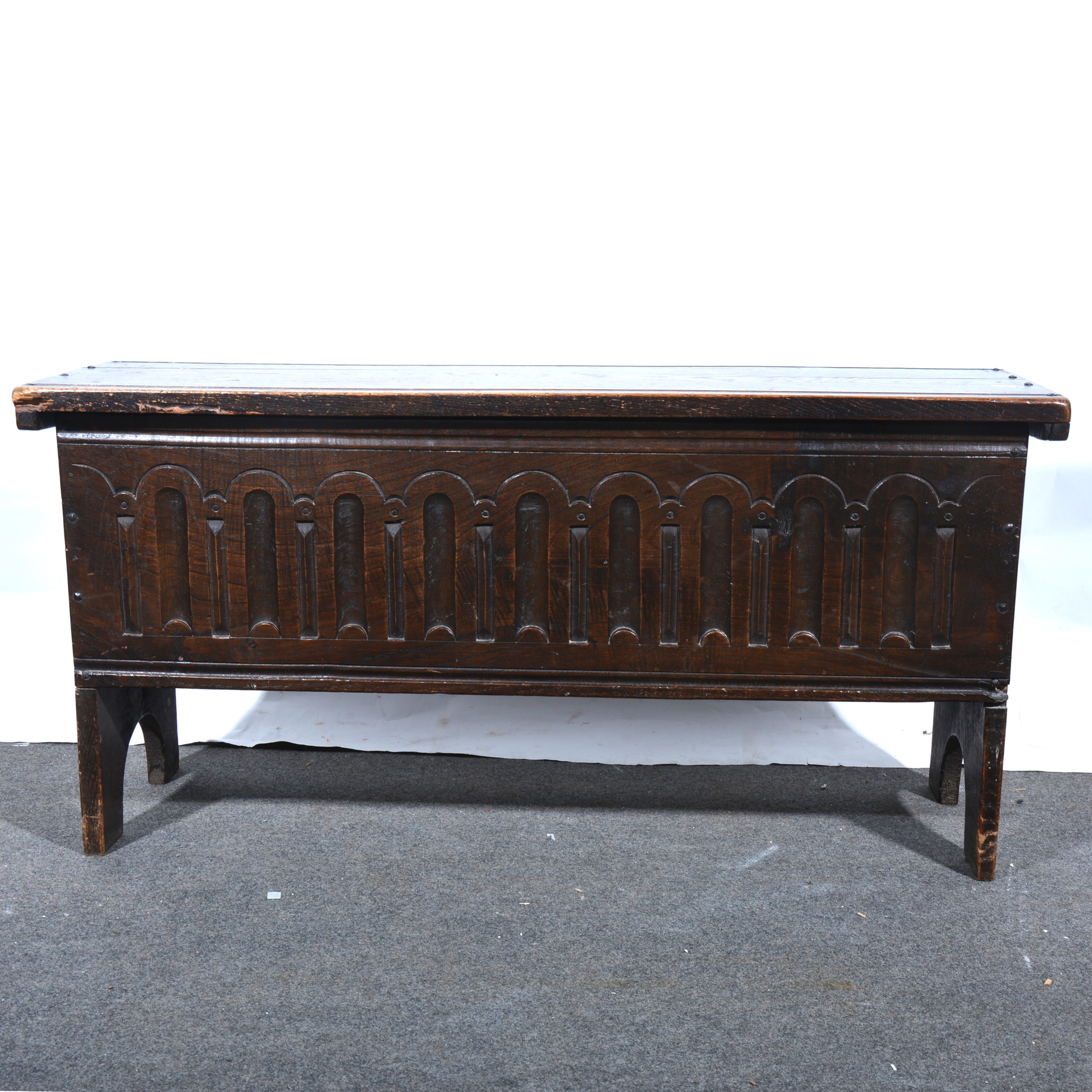 A reproduction oak six plank coffer, small size.