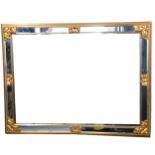 A contemporary gilt and mirrored wall mirror