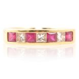Ruby and diamond half eternity ring, 18 carat gold.