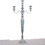 A large patinated brass three-light candlestand.