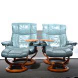 A pair of 'Stressless' leather adjustable easy chairs, with stools, and a two-seat sofa.
