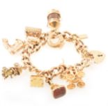 Heavy 9 carat gold charm bracelet with ten charms including two seals.