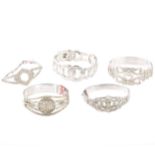 Four paste set costume jewellery bangles and another rhodium plated.