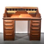 An Edwardian oak roll-top desk.