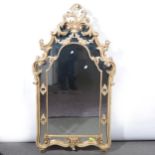 Modern painted, gilt, and carved wall mirror.