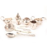 Silver-plated bottle coaster, sugar bowl, pair of sauce boats, lobster picks, basting spoon.