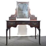 A carved mahogany dressing table, by H. Mawer & Stephenson, London.