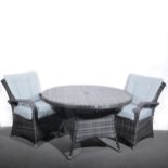 Contemporary woven rattan patio table and four chairs.