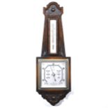 British stained and carved oak cased barometer.