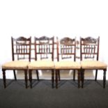 Four late Victorian stained walnut dining chairs.