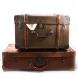 Three vintage canvas and leather suitcases and hats.