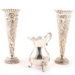 Pair of Victorian silver spill vases and a silver cream jug.