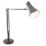 A vintage black Anglepoise lamp.