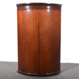 George III mahogany cylinder front corner cupboard.