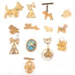 One celluloid and twelve gilt metal Scottie dog brooches, 1930's and later.