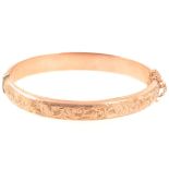 A 9 carat rose gold Victorian style half hinged bangle.