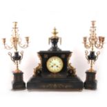 A Victorian slate, marble, and gilt metal clock garniture.